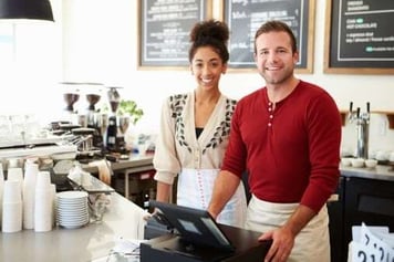 Man_and_woman_working_at_a_coffee_shop