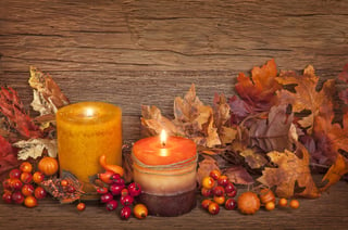 candles with leaves and berries
