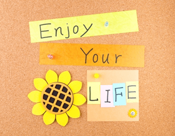 enjoy your life pinned to cork board